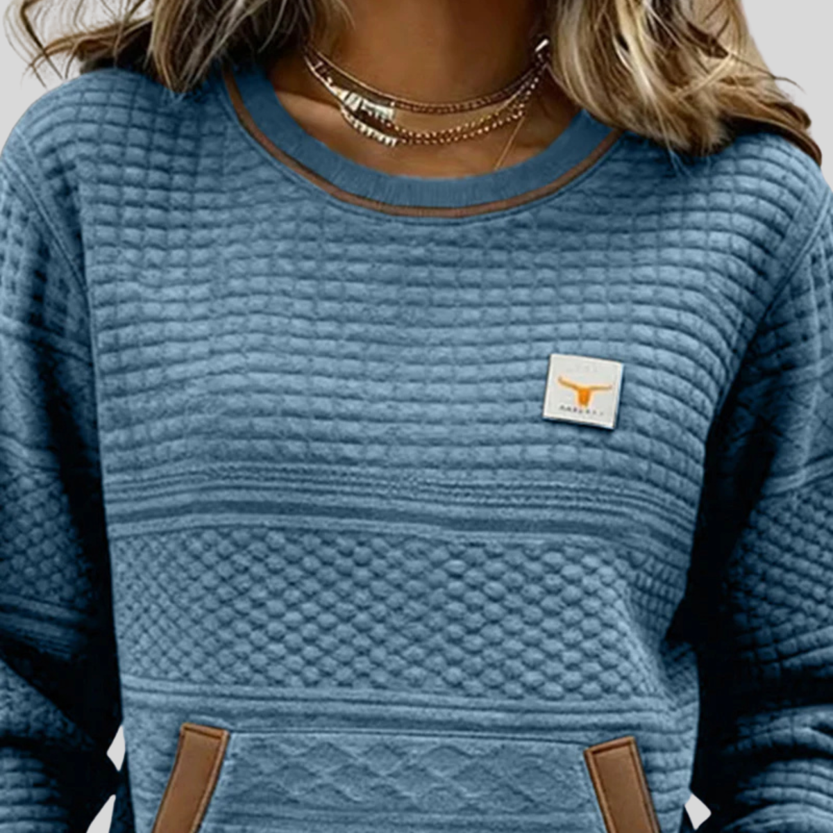 Bérénice gewatteerde sweater met ronde hals